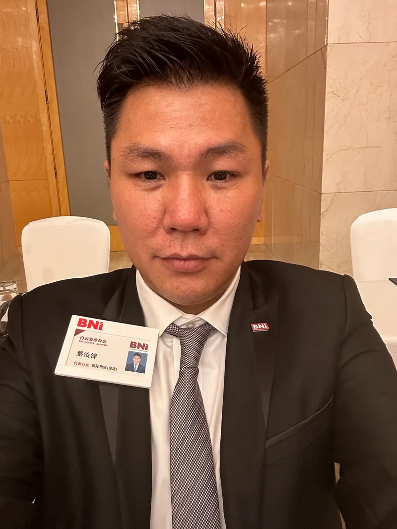 Chase Cai wearing his BNI Galaxy Chapter member badge